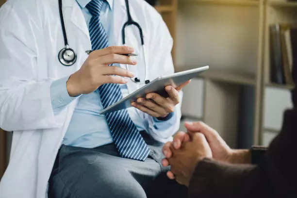 Doctor consulting with patient